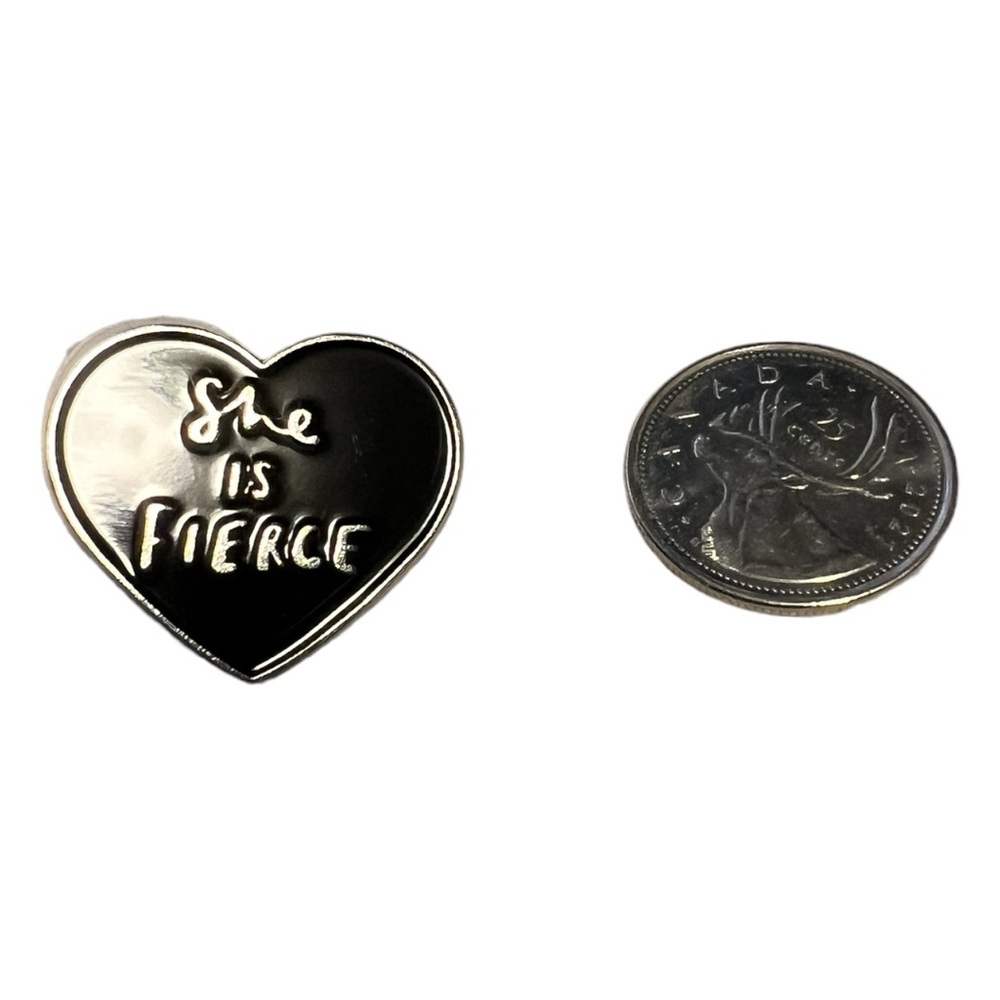 A pin stating “ She is Fierce “